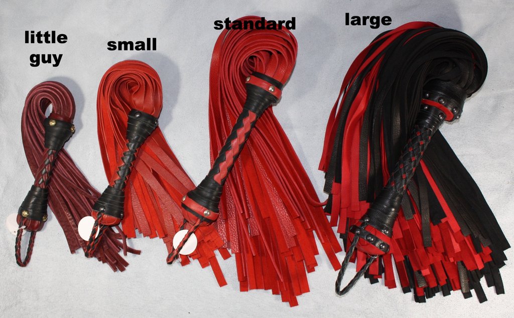 Custom leather impact toy kit by Agreeable Agony, featuring matching leather tools and accessories on a clean background.