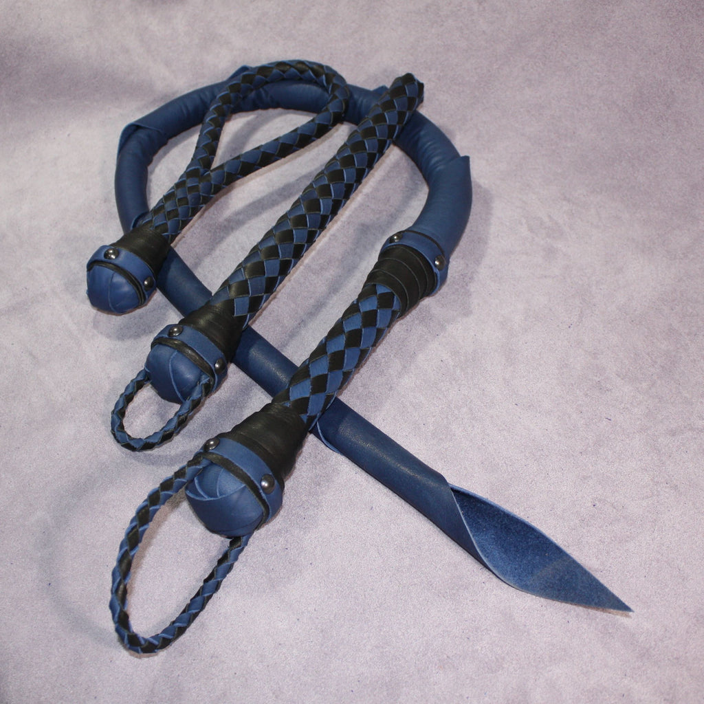 Custom leather impact toy kit by Agreeable Agony featuring matching handmade leather tools on a neutral background.