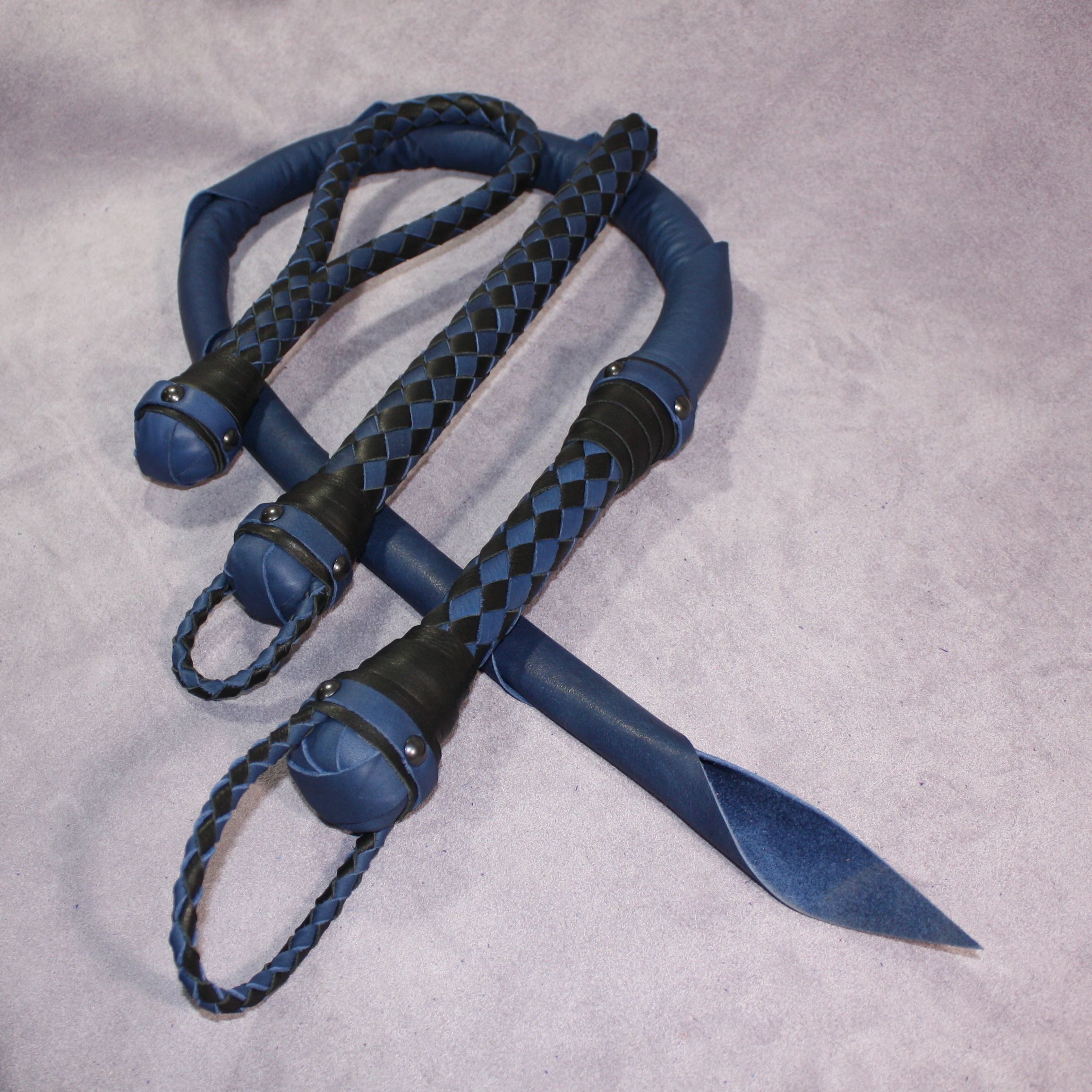 Custom leather impact toy kit by Agreeable Agony featuring matching handmade leather tools on a neutral background.