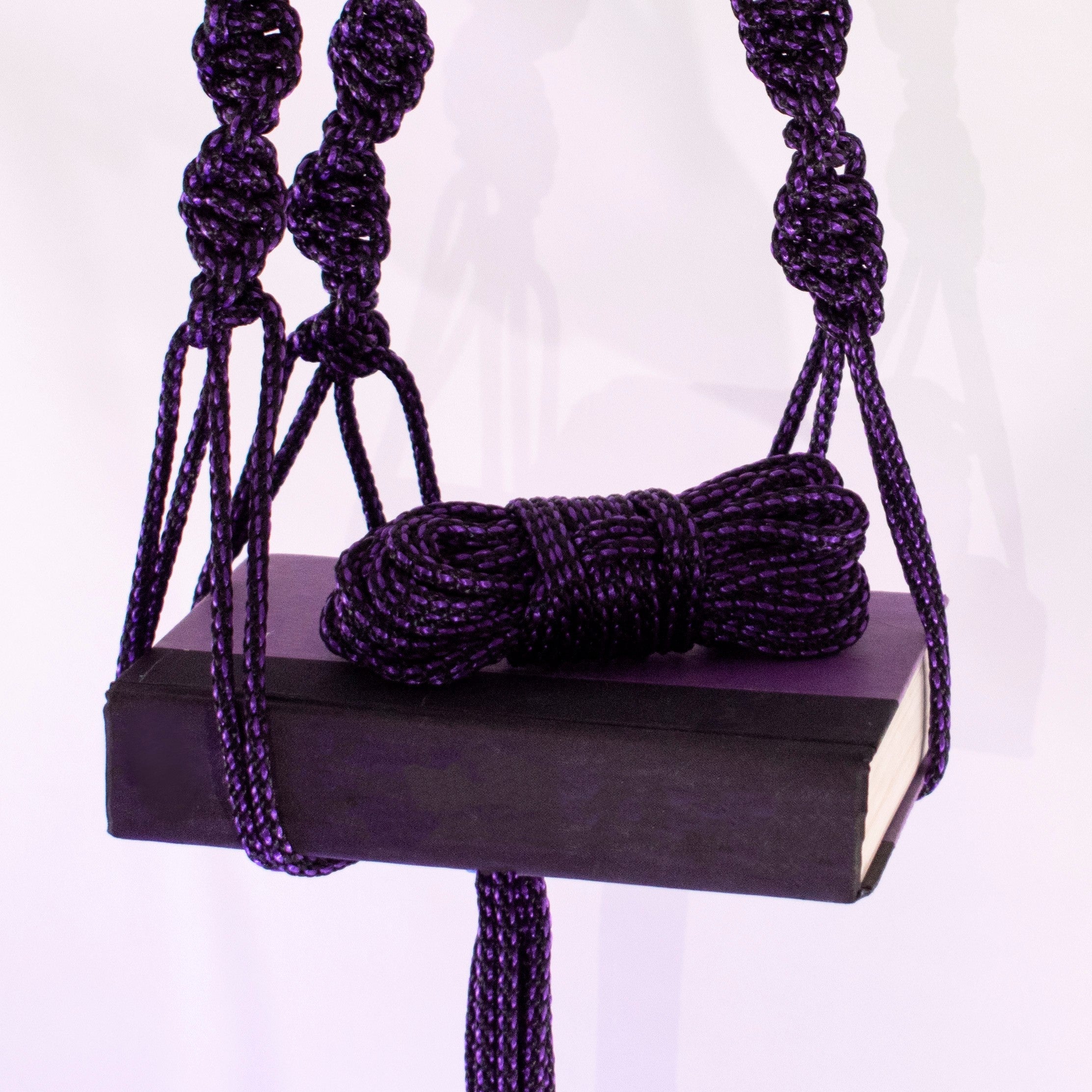 Purple and black 1/4 inch (6mm) solid braid MFP rope from Agreeable Agony bondage rope kit, shown in close-up detail.