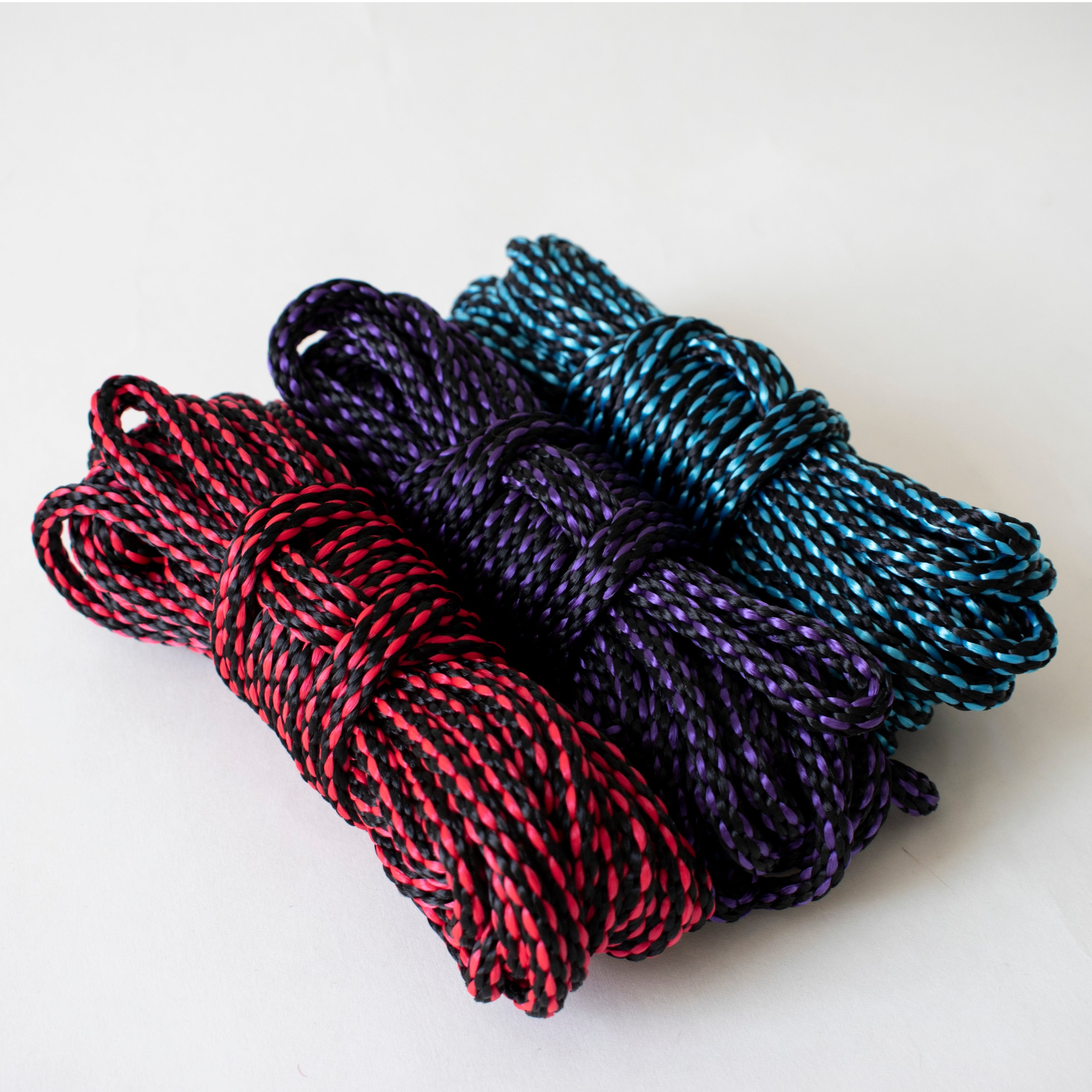 Colorful 1/4-inch (6mm) solid braid MFP bondage rope kit by Agreeable Agony, shown with vibrant red and black ropes.