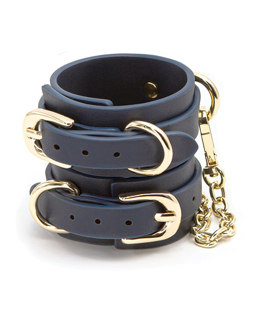 Blue Bondage Couture vinyl wrist cuff from Not Just Sex Toys, featuring a sleek, adjustable restraint for adult play.