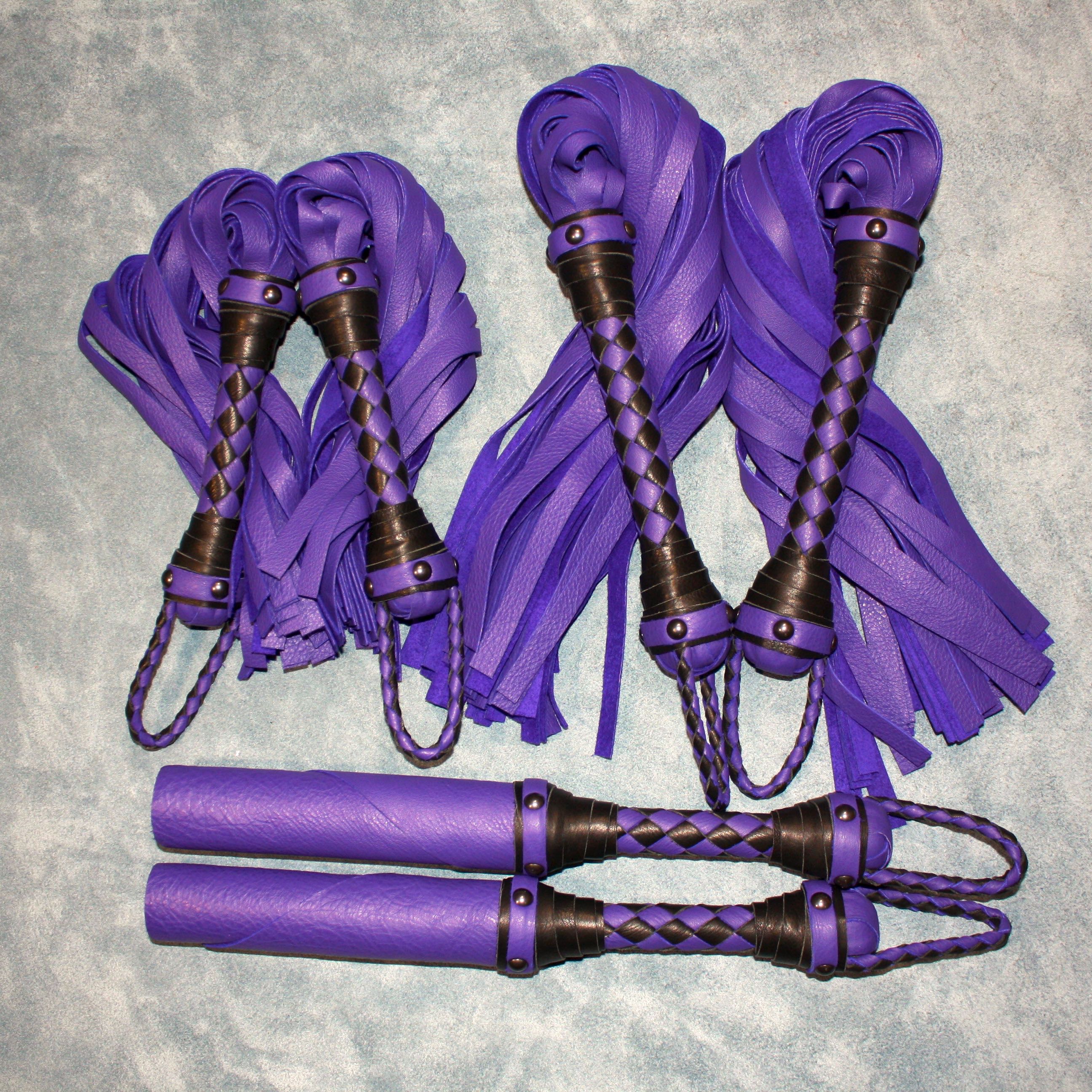 Custom leather impact toy kit by Agreeable Agony featuring matching leather tools and accessories on a neutral background.