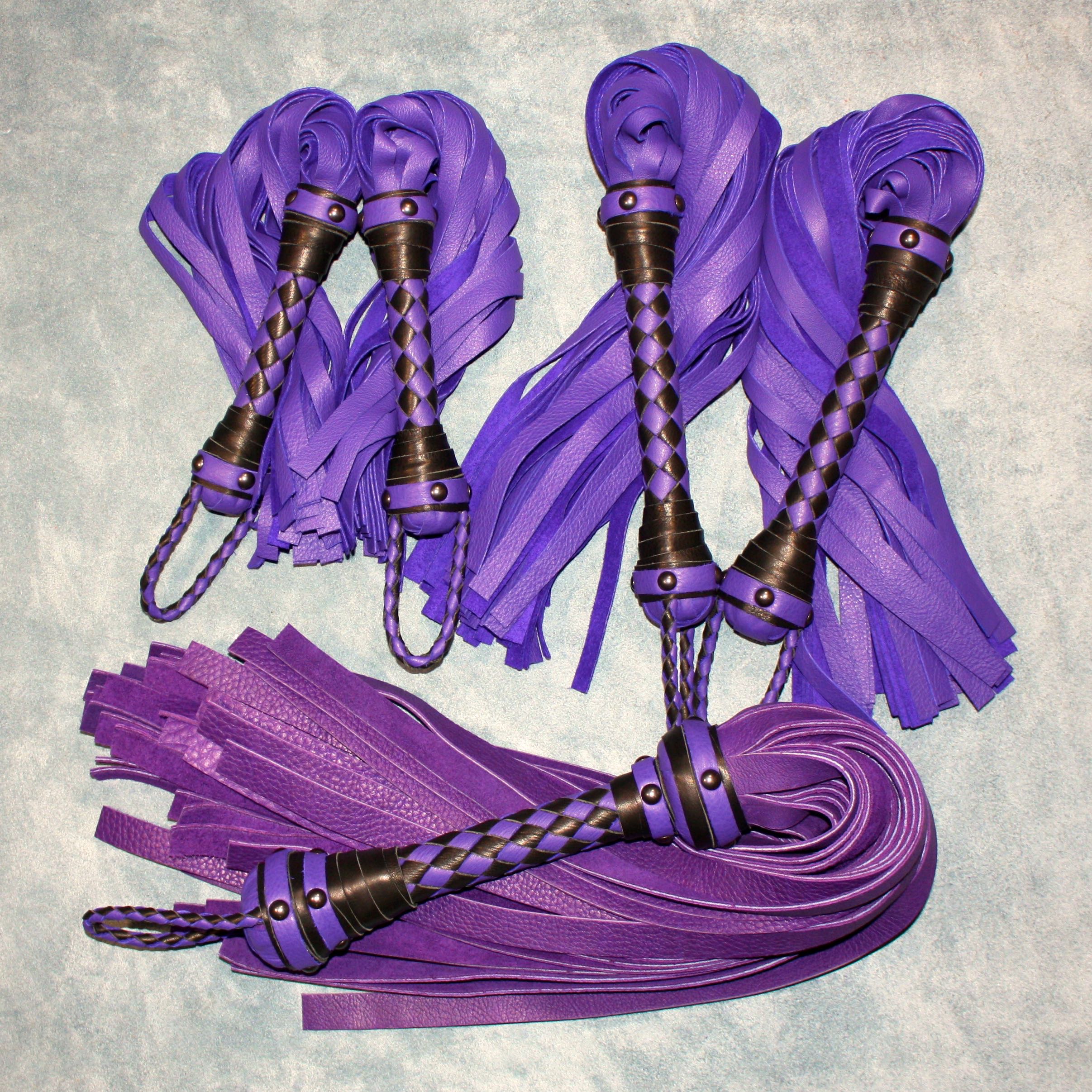 Custom leather impact toy kit by Agreeable Agony featuring matching leather tools and accessories on a neutral background.