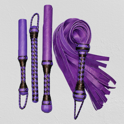Agreeable Agony coordinated leather impact toy kit with custom design, featuring leather straps and handles for impact play.
