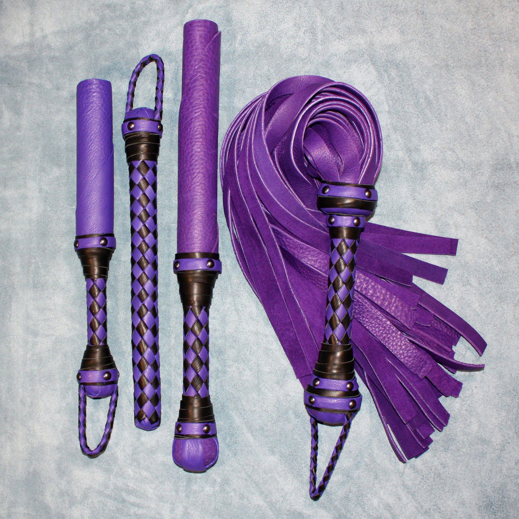 Custom leather impact toy kit by Agreeable Agony featuring matching leather accessories and tools in a coordinated set.