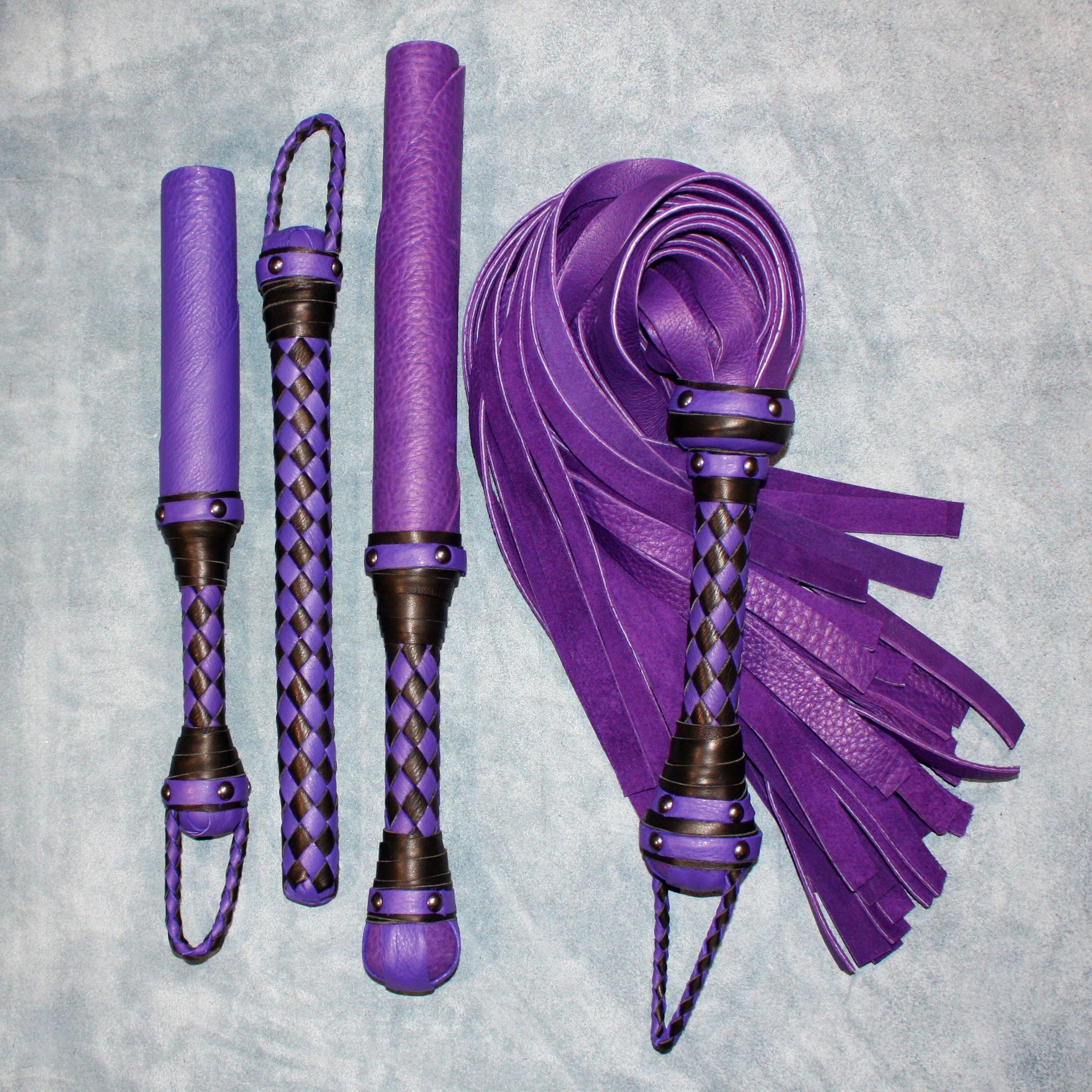 Custom leather impact toy kit by Agreeable Agony featuring matching leather accessories and tools in a coordinated set.