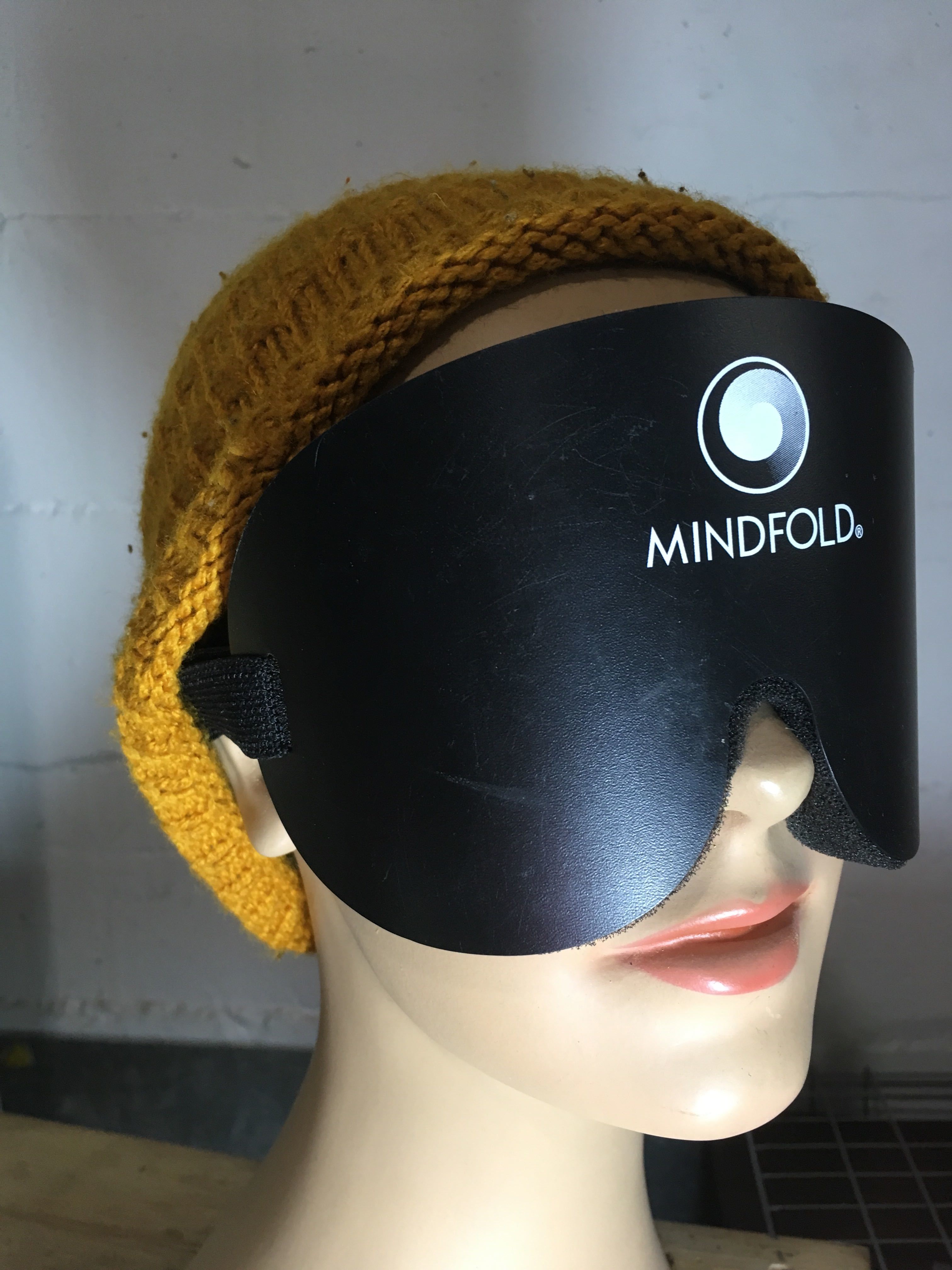 Mindfold sensory deprivation mask by Agreeable Agony, black blindfold for kink and sensory play, shown on a neutral background.