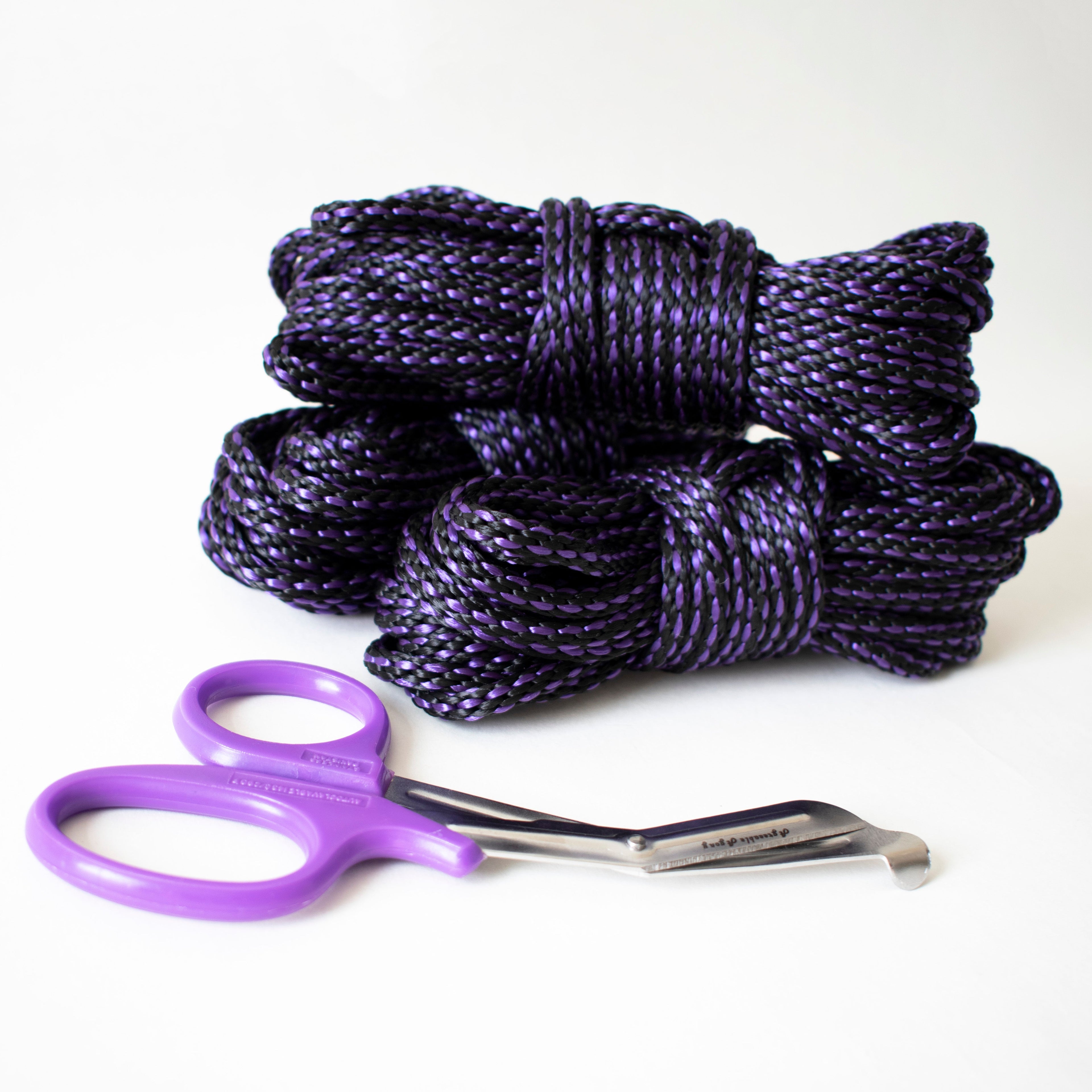 Purple and black 6mm solid braid MFP rope from Agreeable Agony bondage rope kit, showing the colorful, textured rope.