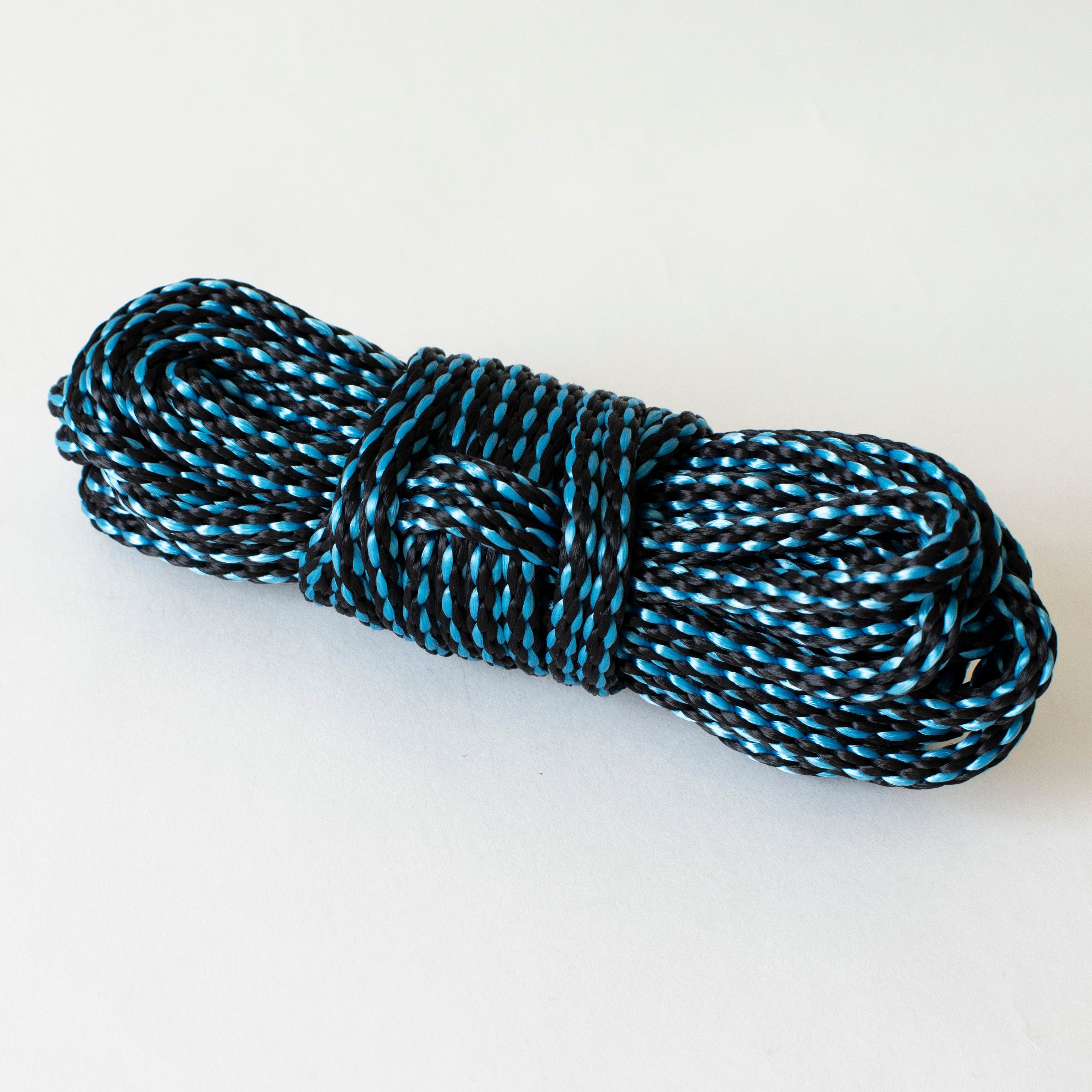 Aqua and black 1/4-inch solid braid MFP bondage rope kit by Agreeable Agony, showing the textured rope coiled on a neutral background.