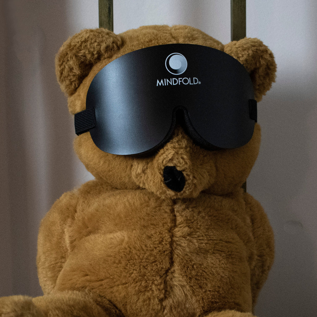 Black Mindfold sensory deprivation mask by Agreeable Agony, designed for kink and sensory play, shown on a person.