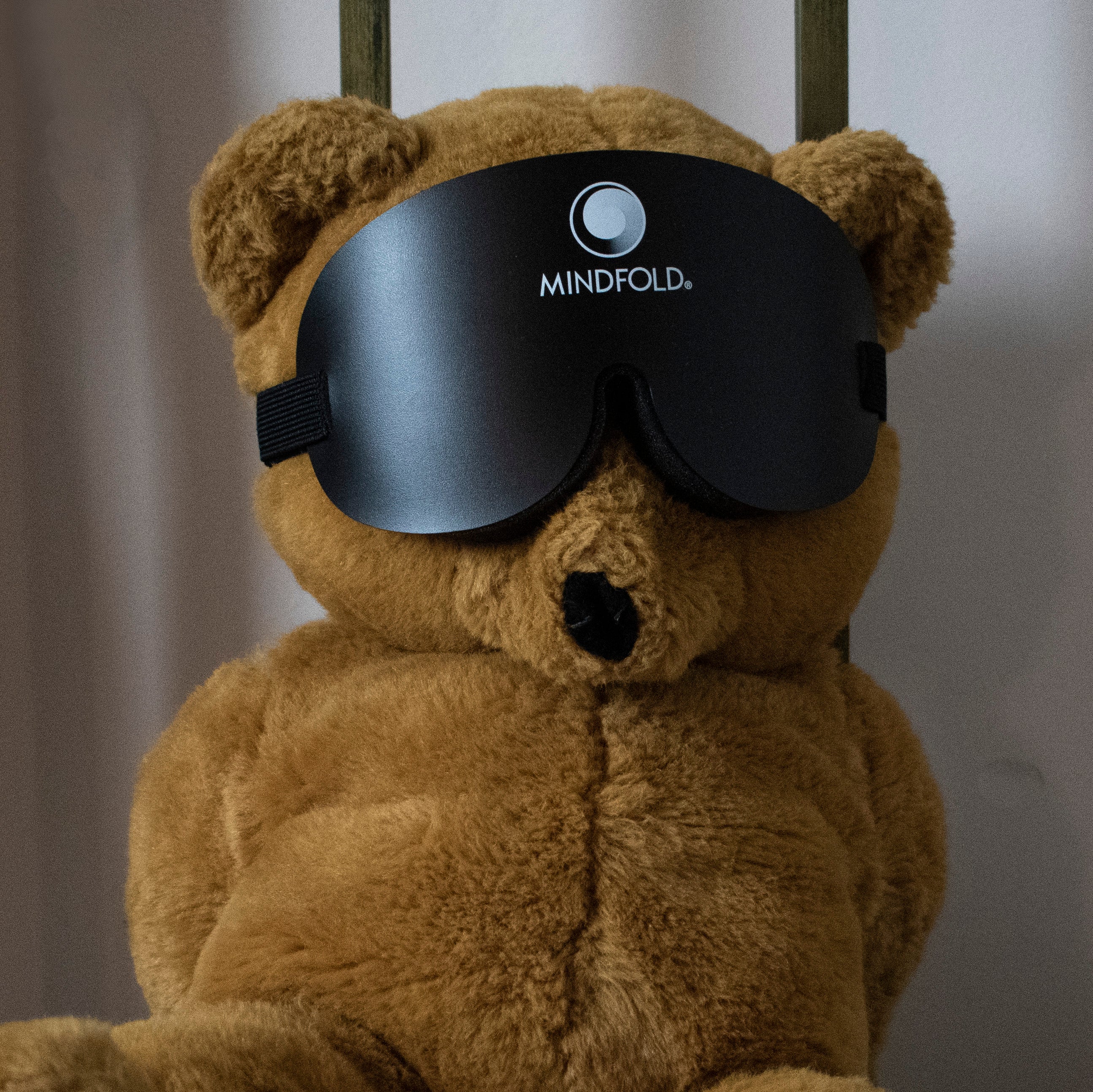 Black Mindfold sensory deprivation mask by Agreeable Agony, designed for kink and sensory play, shown on a person.