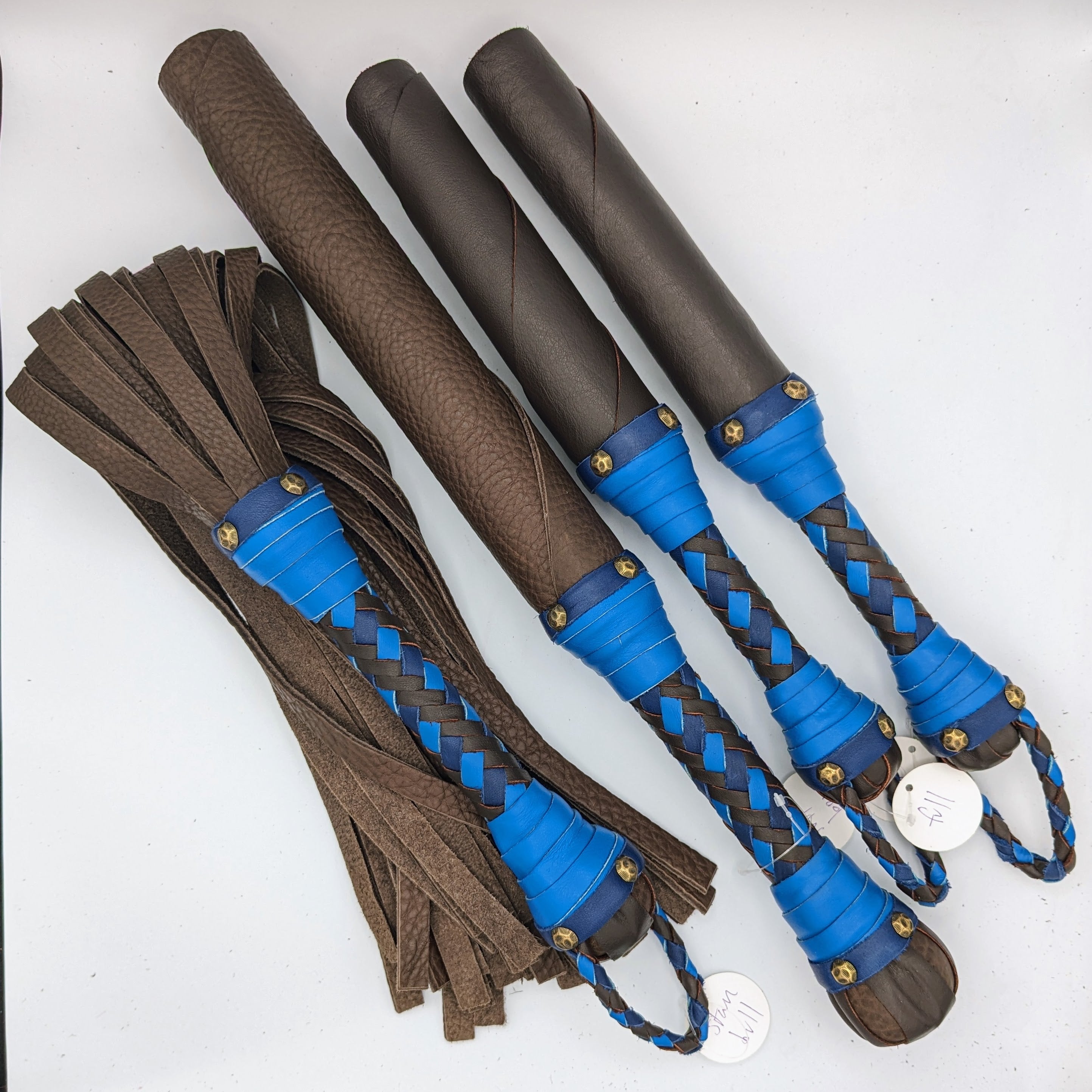 Custom leather impact toy kit from Agreeable Agony, featuring matching leather tools and accessories for sensory play.