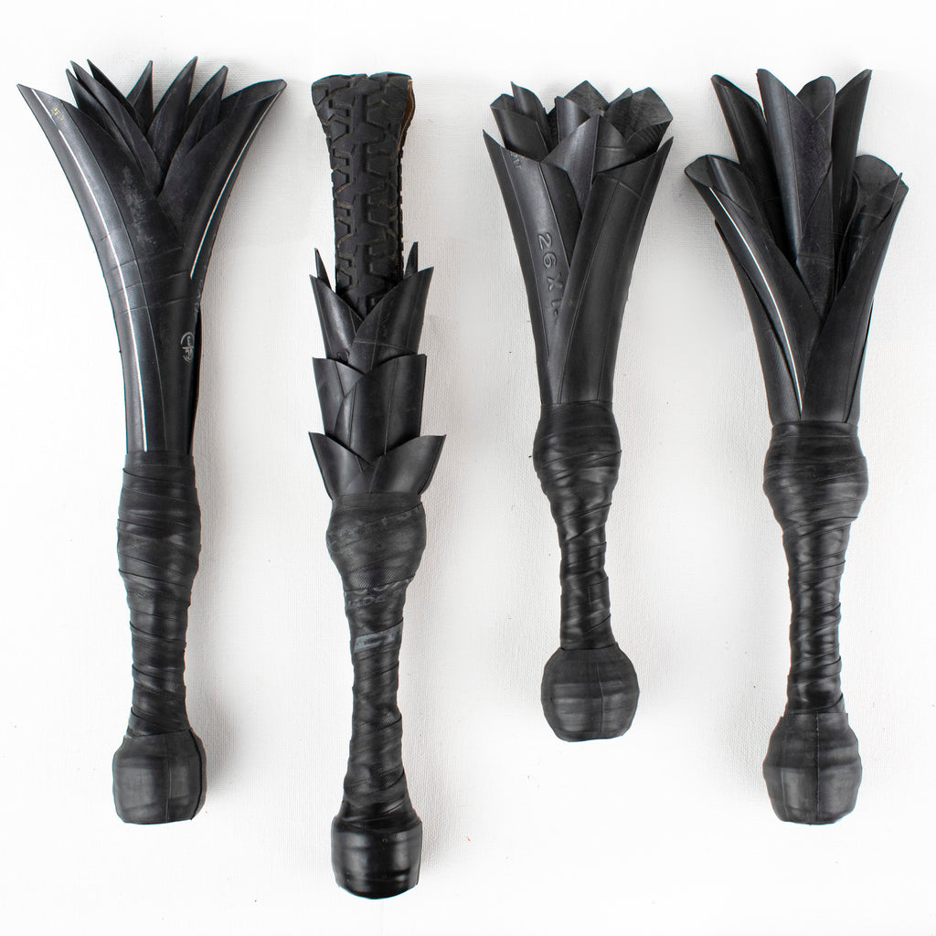 Agreeable Agony Petal Slapper rubber paddle with floral design, in stock leather handle, ideal for sensory play or adult activities.