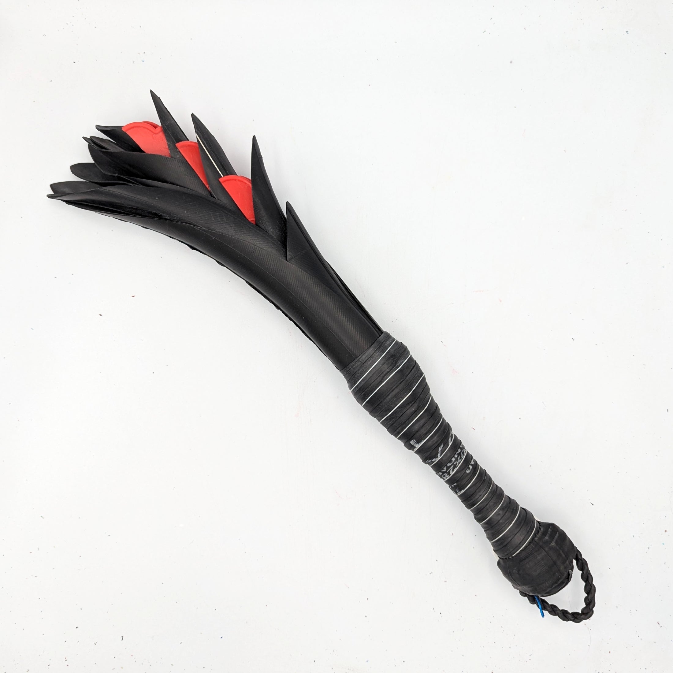 Agreeable Agony Petal Slapper rubber paddle with flower design, in stock leather hand-held slapper for sensory play.