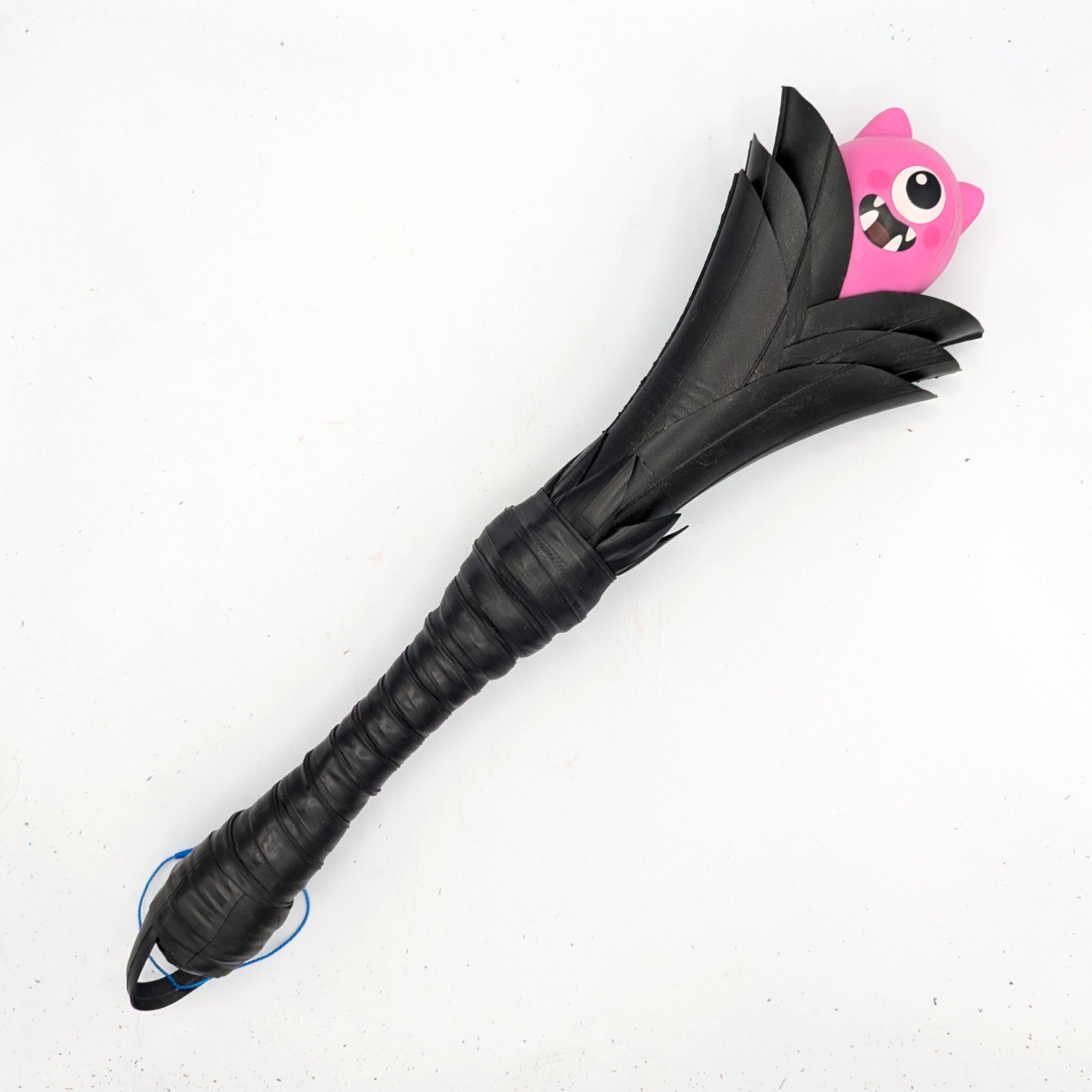 Agreeable Agony Petal Slapper rubber paddle with flower design, in stock leather, for sensory play or light impact activities.