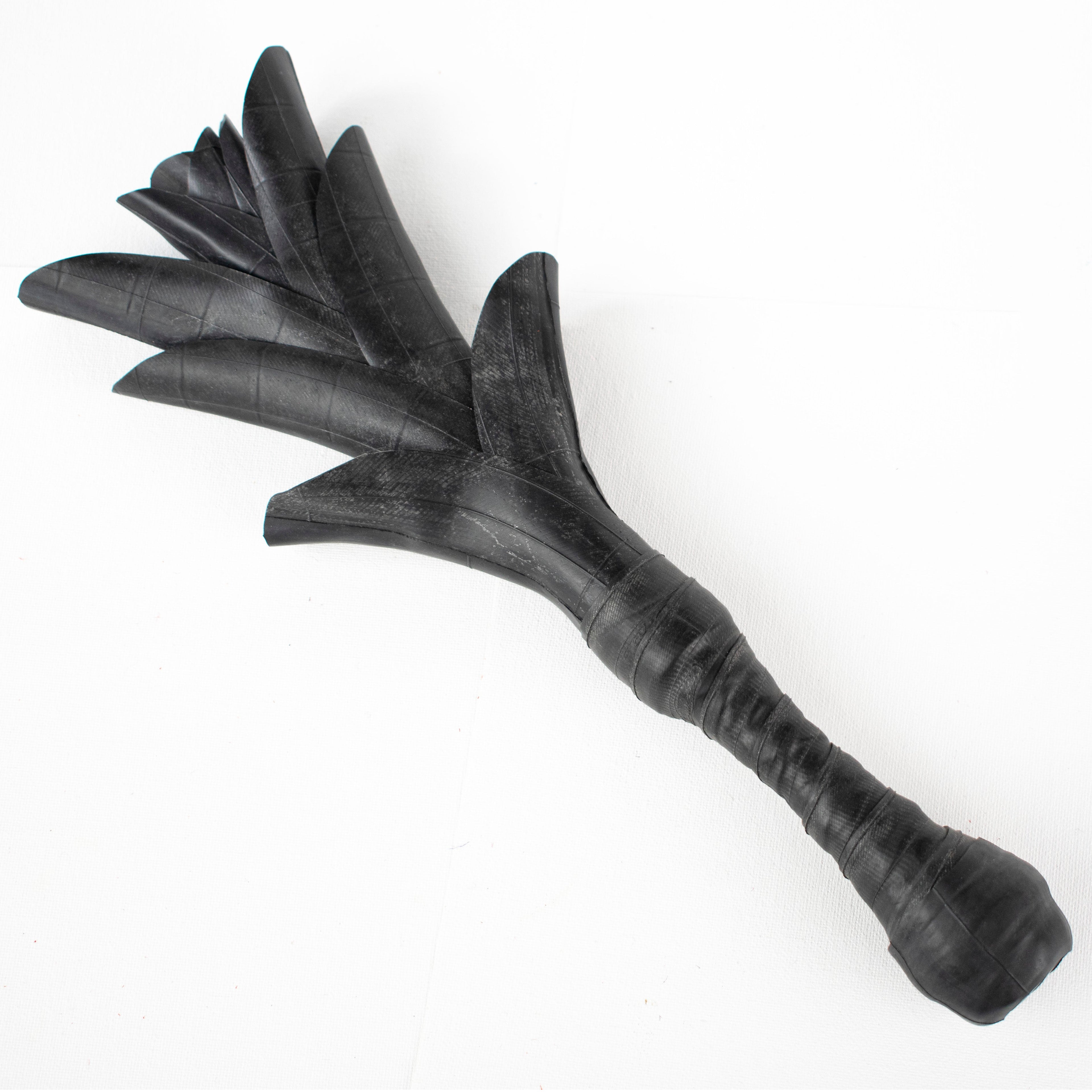 Agreeable Agony Petal Slapper rubber paddle with leather handle, flower design, suitable for playful petal slapping.