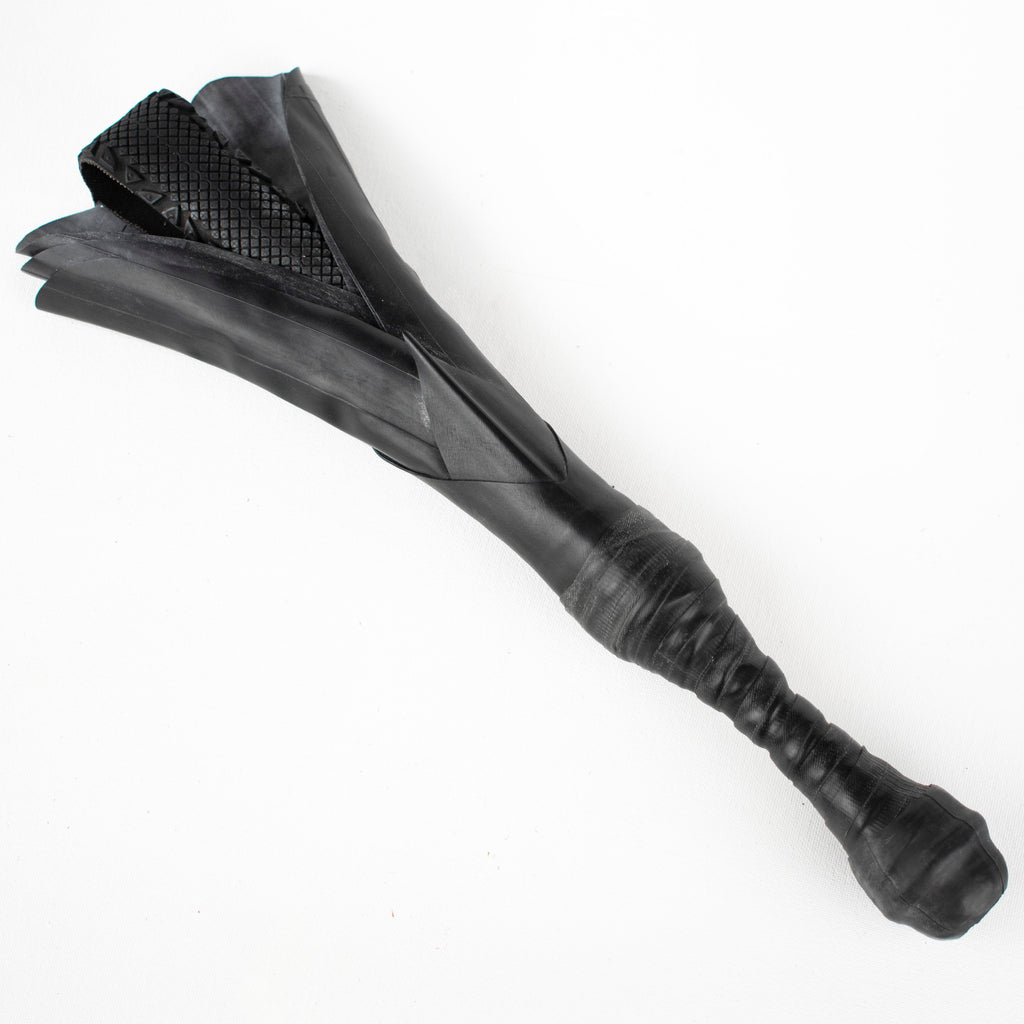 Agreeable Agony Petal Slapper rubber paddle with leather handle, flower design for playful sensation, in stock.