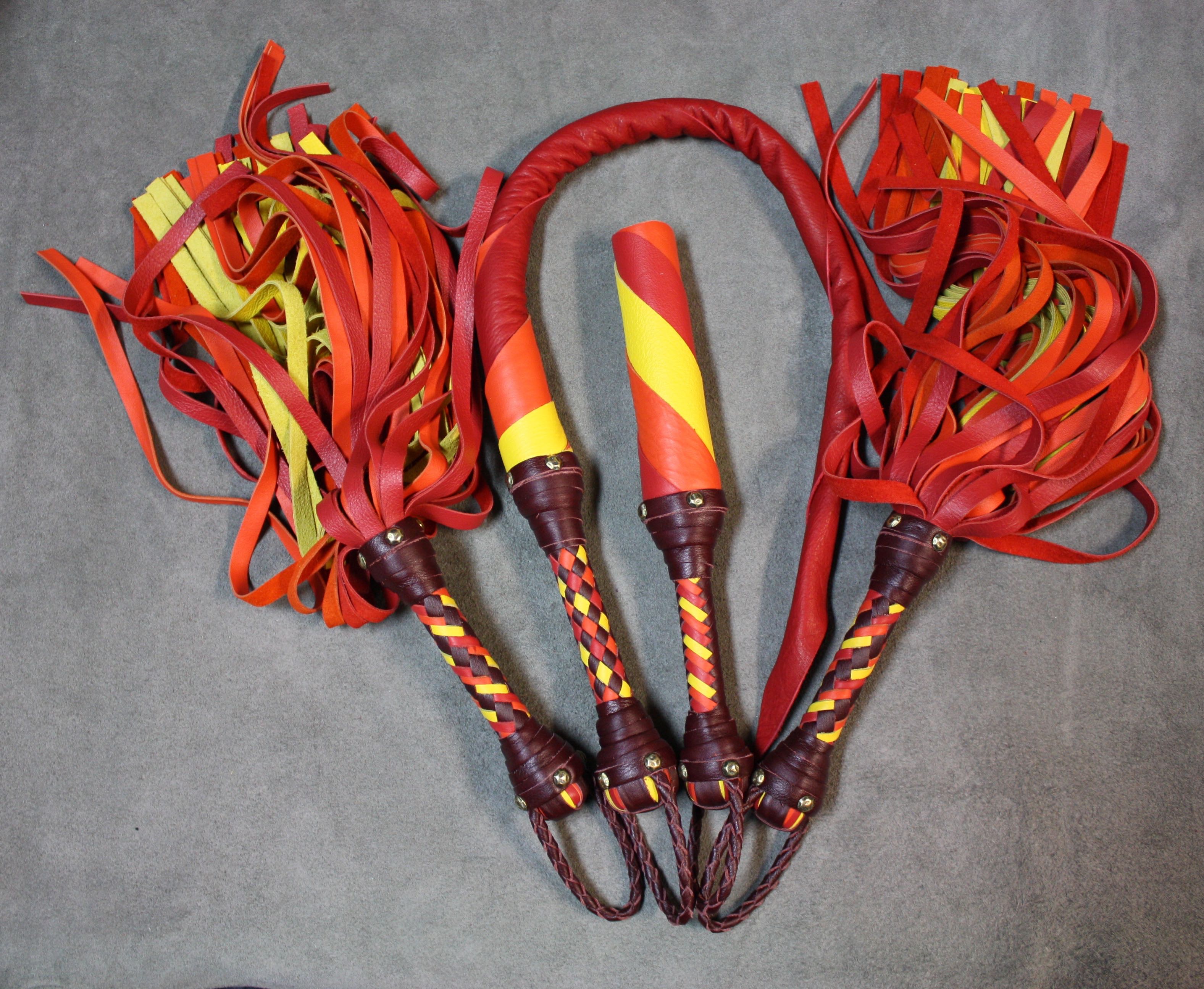 Leather impact toy kit from Agreeable Agony featuring a flame design, including matching leather accessories for custom impact play.