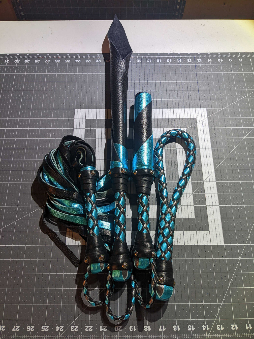 Leather impact toy kit by Agreeable Agony featuring matching custom leather accessories for impact play.